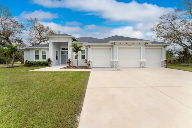 prairie-style home with a front yard and a garage