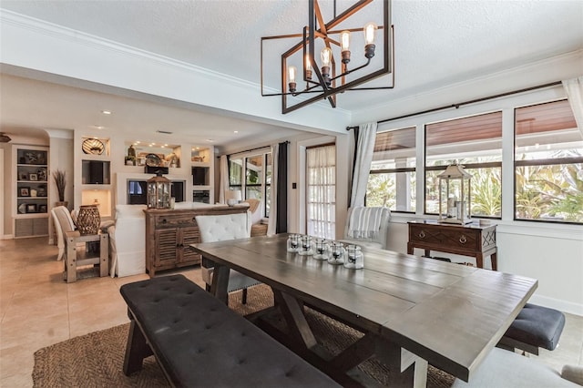 dining area featuring a textured ceiling, crown molding, light tile patterned floors, built in features, and a notable chandelier