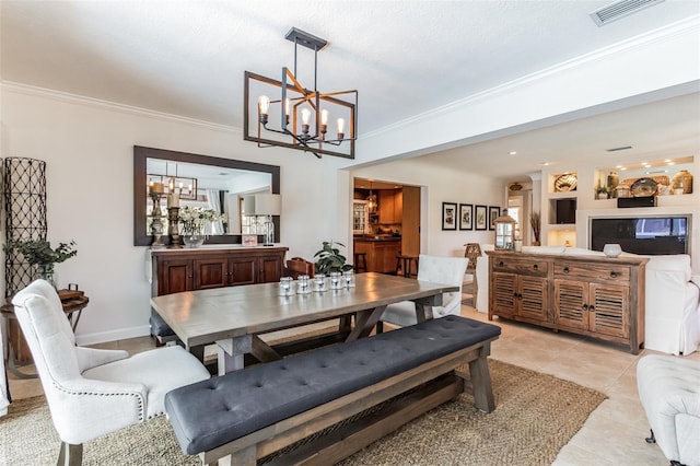 dining area featuring a textured ceiling, a notable chandelier, light tile patterned floors, and crown molding