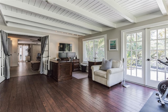 interior space featuring beam ceiling, dark hardwood / wood-style flooring, ceiling fan, and plenty of natural light