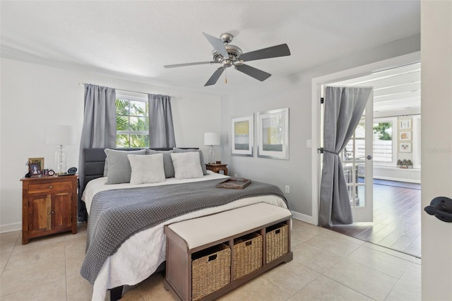 bedroom with ceiling fan, light wood-type flooring, and multiple windows