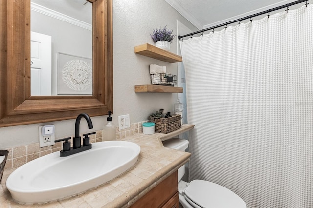 bathroom featuring vanity, toilet, and crown molding