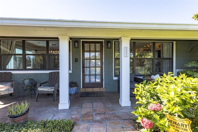 doorway to property featuring a porch