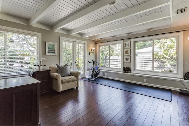 living area featuring dark hardwood / wood-style floors, beam ceiling, and french doors