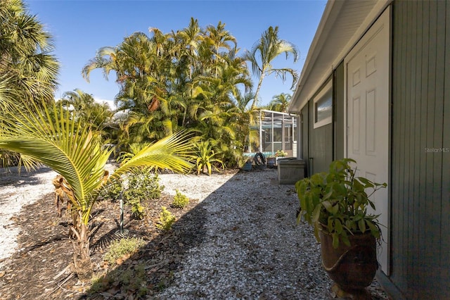 view of yard featuring a lanai