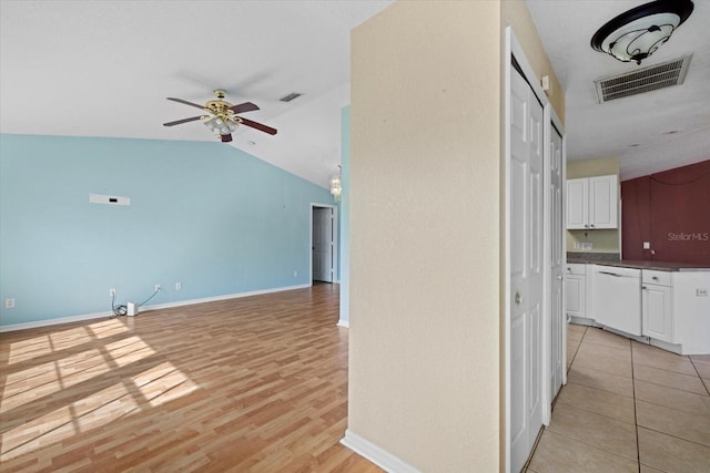 interior space featuring light hardwood / wood-style floors and lofted ceiling