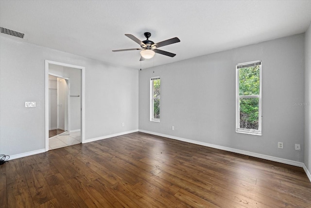 unfurnished room with hardwood / wood-style floors and ceiling fan