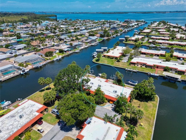 drone / aerial view with a residential view and a water view