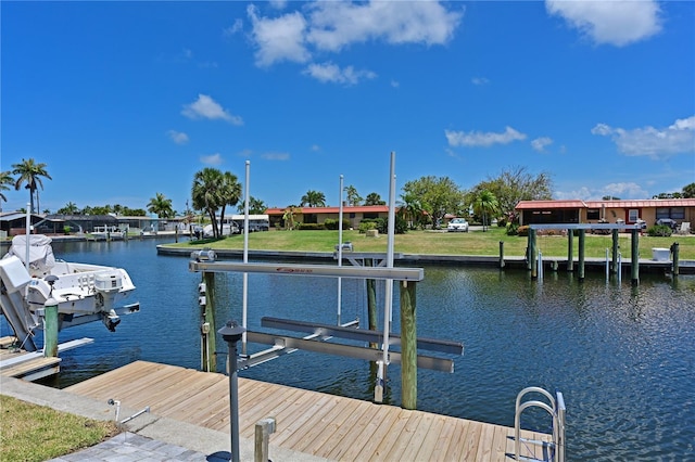 view of dock featuring a water view and boat lift