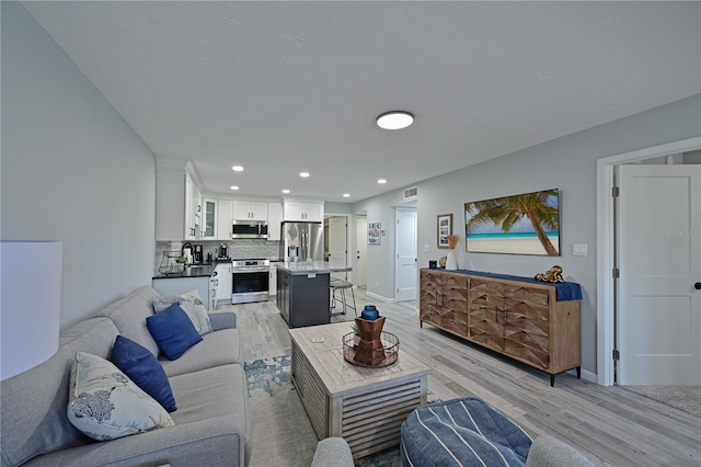 living room with light hardwood / wood-style floors