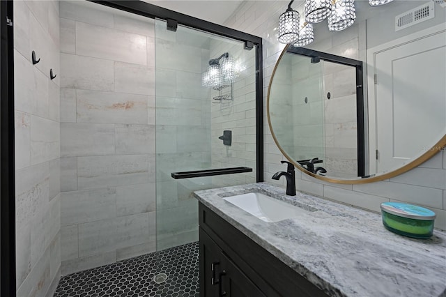 bathroom with vanity and walk in shower