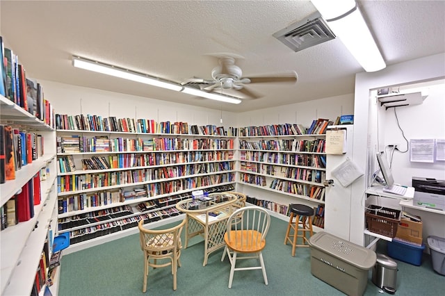 office area featuring carpet and a textured ceiling