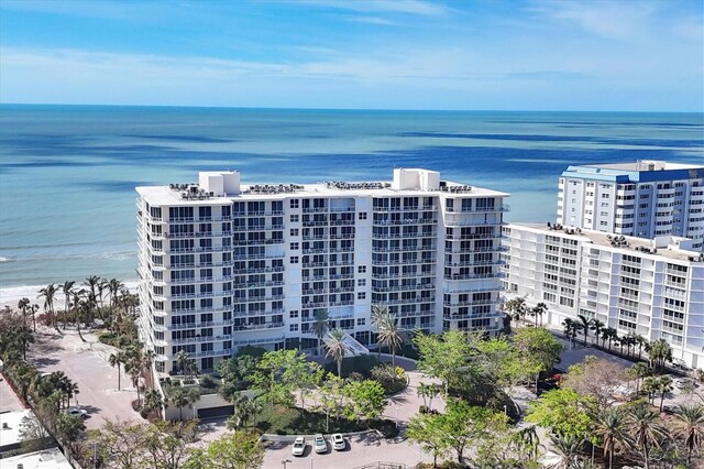 bird's eye view featuring a water view and a view of the beach