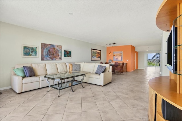 1800 Benjamin Franklin Dr Unit A304, Sarasota, FL 34236 - living area with light tile patterned floors and a textured ceiling