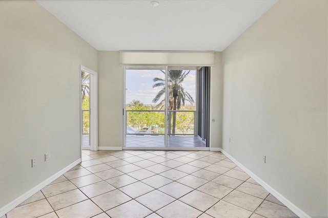 1800 Benjamin Franklin Dr Unit A304, Sarasota, FL 34236 - empty room featuring light tile patterned floors and baseboards