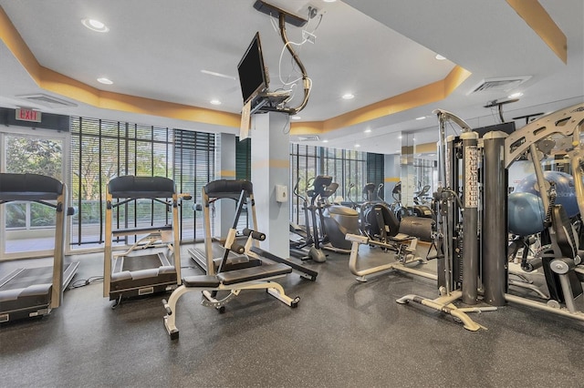 1800 Benjamin Franklin Dr Unit A304, Sarasota, FL 34236 - workout area with a tray ceiling and recessed lighting