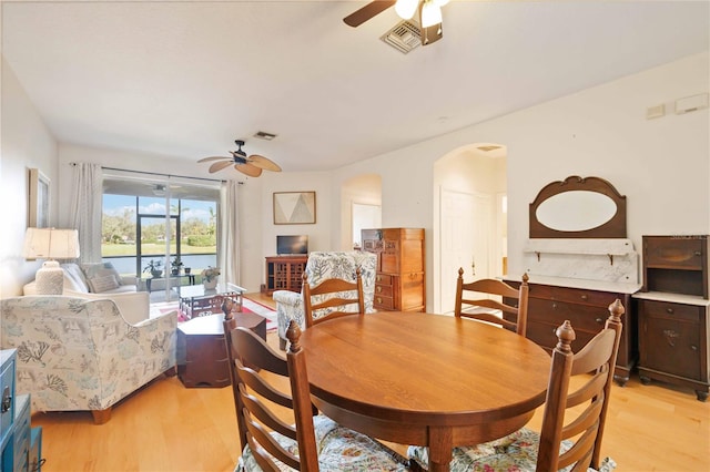 dining room featuring light hardwood / wood-style flooring and ceiling fan