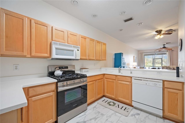 4209 Cascade Falls Dr, Sarasota, FL 34243 - kitchen with white appliances, light brown cabinetry, light marble finish floors, a ceiling fan, and recessed lighting