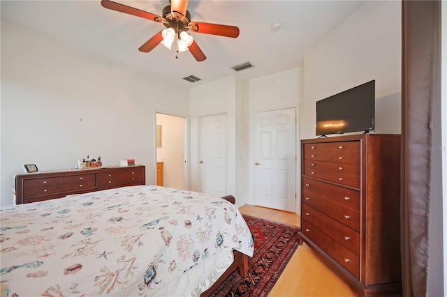 bedroom featuring light wood-type flooring and ceiling fan