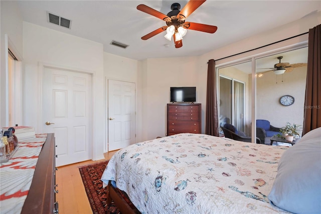 4209 Cascade Falls Dr, Sarasota, FL 34243 - bedroom with light wood-type flooring and ceiling fan