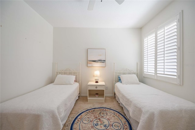 4209 Cascade Falls Dr, Sarasota, FL 34243 - bedroom with light carpet, a ceiling fan, and baseboards