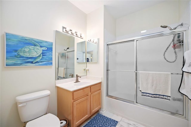 full bathroom with shower / bath combination with glass door, vanity, and toilet