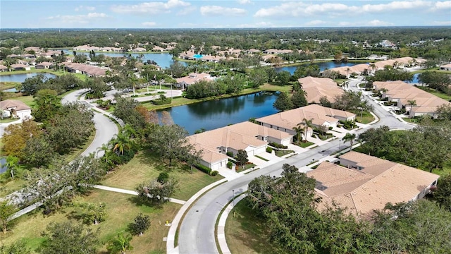 4209 Cascade Falls Dr, Sarasota, FL 34243 - aerial view of property and surrounding area featuring nearby suburban area, a large body of water, and a tree filled landscape