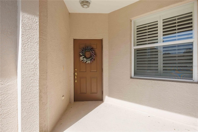4209 Cascade Falls Dr, Sarasota, FL 34243 - entrance to property featuring stucco siding