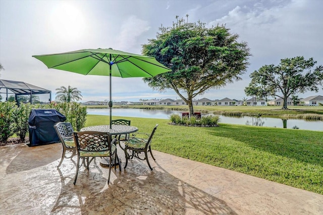 view of patio featuring a water view and area for grilling