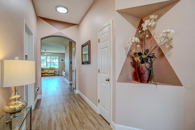 hallway with light hardwood / wood-style flooring