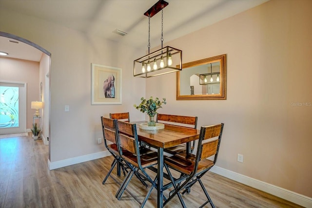 dining area with light hardwood / wood-style flooring