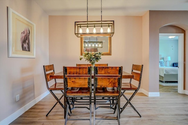 dining space featuring hardwood / wood-style floors