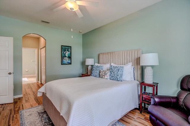 bedroom with ceiling fan, a closet, and light hardwood / wood-style flooring