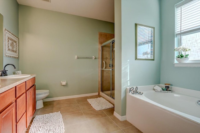 full bathroom with tile patterned flooring, shower with separate bathtub, vanity, and toilet