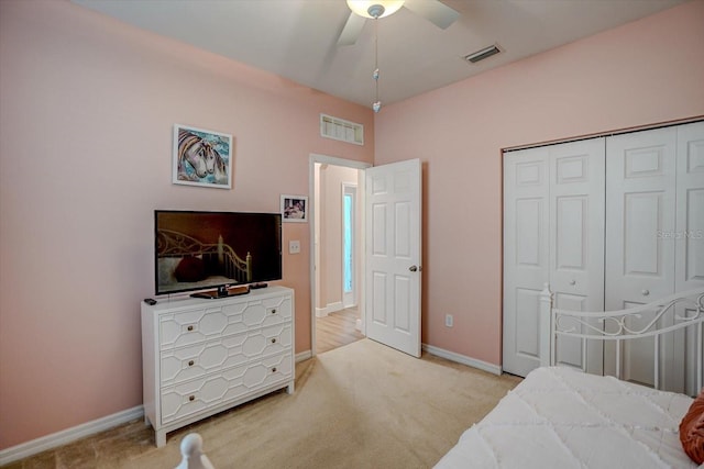 carpeted bedroom with a closet and ceiling fan