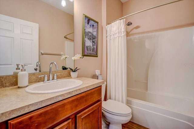 full bathroom featuring shower / tub combo with curtain, vanity, hardwood / wood-style floors, and toilet