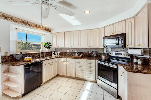 kitchen featuring ceiling fan, sink, dark stone counters, light tile patterned floors, and black appliances