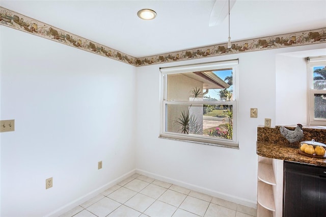 unfurnished dining area with plenty of natural light and light tile patterned floors