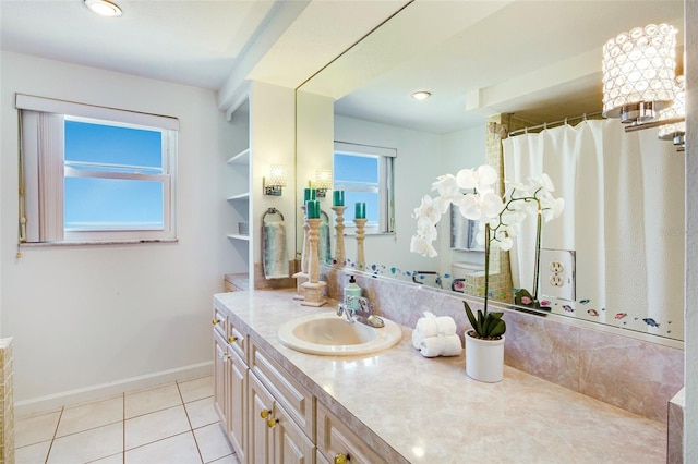 bathroom with tile patterned flooring and vanity