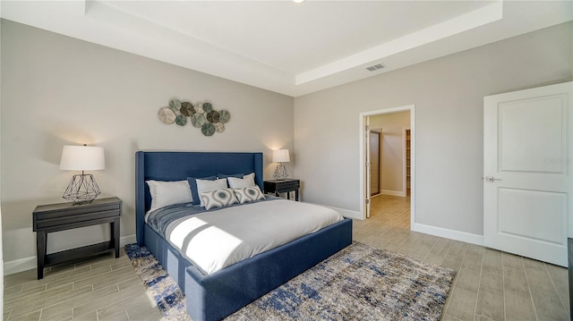 bedroom with a tray ceiling