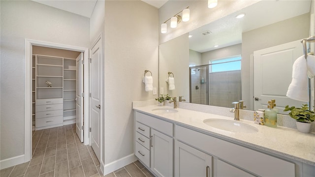 bathroom with vanity and walk in shower