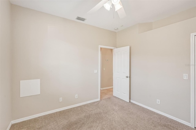 carpeted empty room with ceiling fan