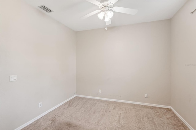 unfurnished room with ceiling fan and light colored carpet