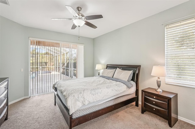 bedroom featuring light carpet, access to outside, and ceiling fan