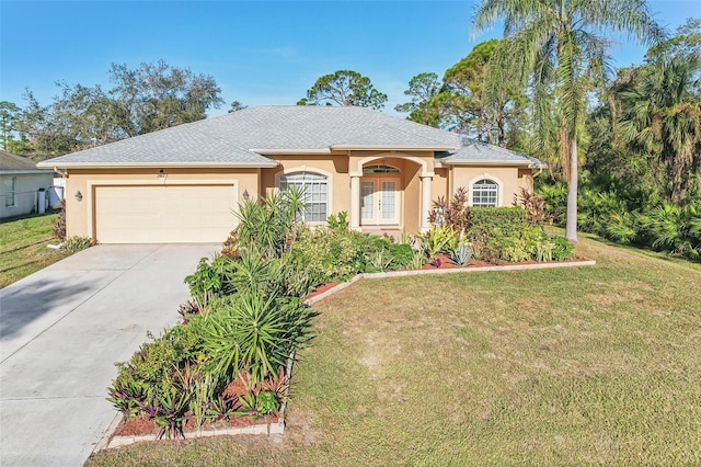 single story home featuring a garage and a front yard