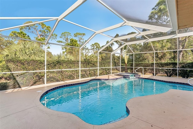 view of pool featuring a patio area and a pool with connected hot tub