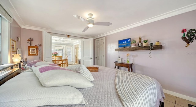 tiled bedroom with ceiling fan and ornamental molding