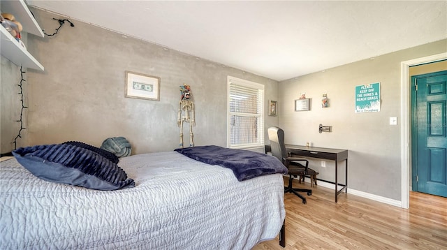 bedroom with light hardwood / wood-style floors