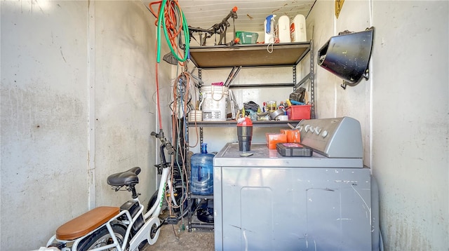 clothes washing area featuring washer / dryer