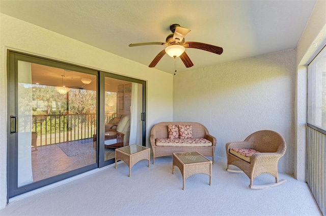 sunroom / solarium with ceiling fan